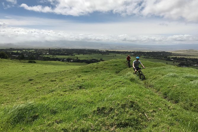 Big Island Mountain Biking on Anna Ranch - Climbing through pasture and tropical plants