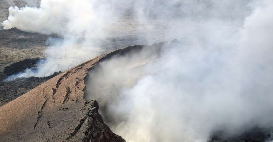 Hilo: Hawaii Volcanoes National Park Flight - Black sand beaches and lava reaching the sea