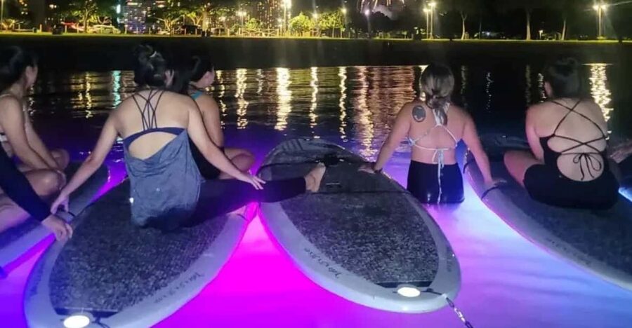 Honolulu: Fireworks Glow and Flow Yoga Class - The first minutes: getting settled on the water