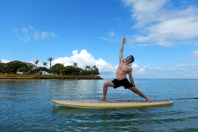 Paddleboard Yoga Class in Honolulu - Wading out and setting the anchor
